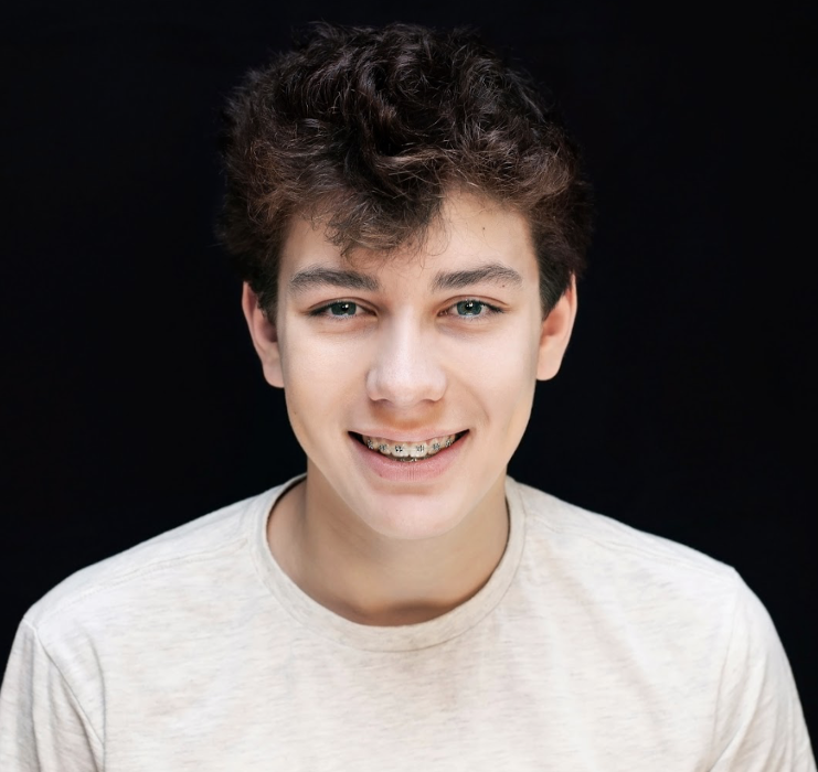 A smiling boy wearing braces