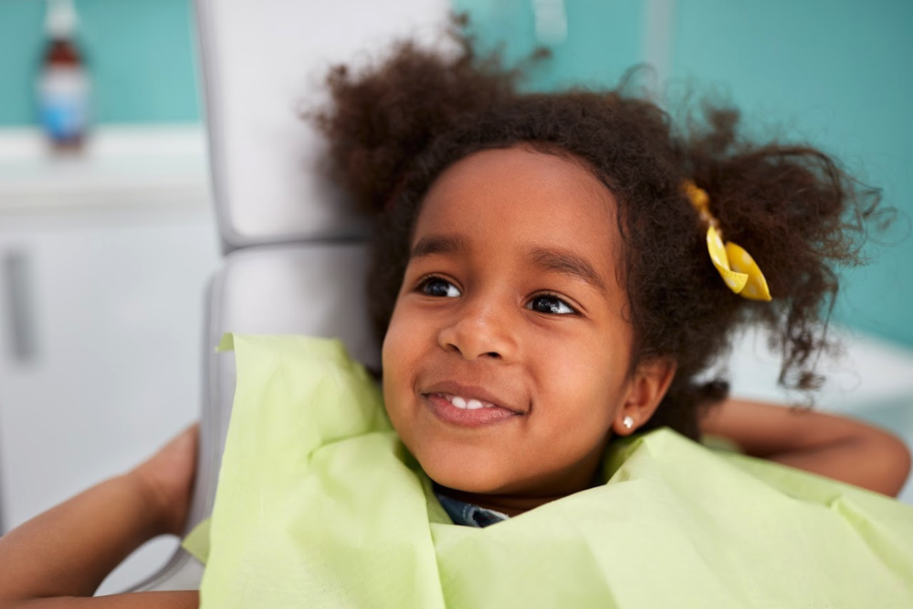 A smiling girl waiting to get tooth colored fillings in Corona, CA