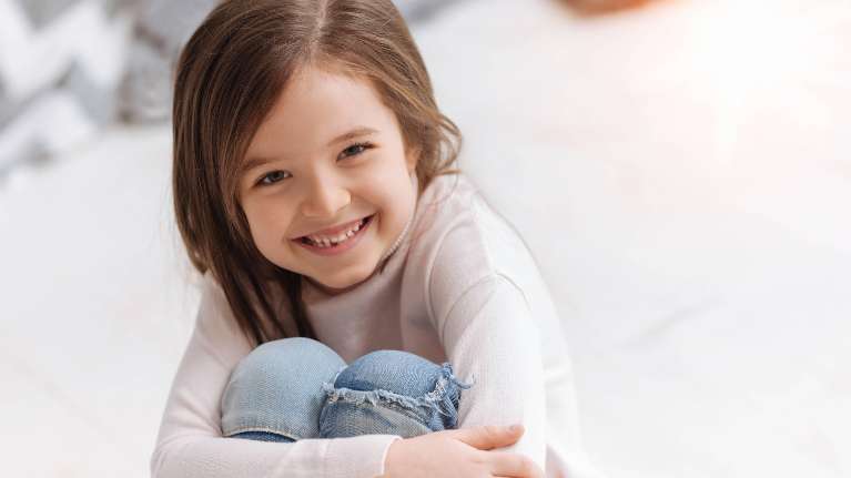 Young girl smiling after dental emergency, Corona CA
