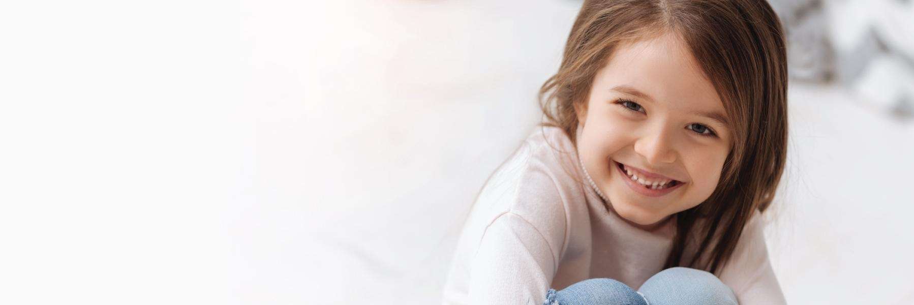 A smiling girl with a missing tooth | dentist Corona CA