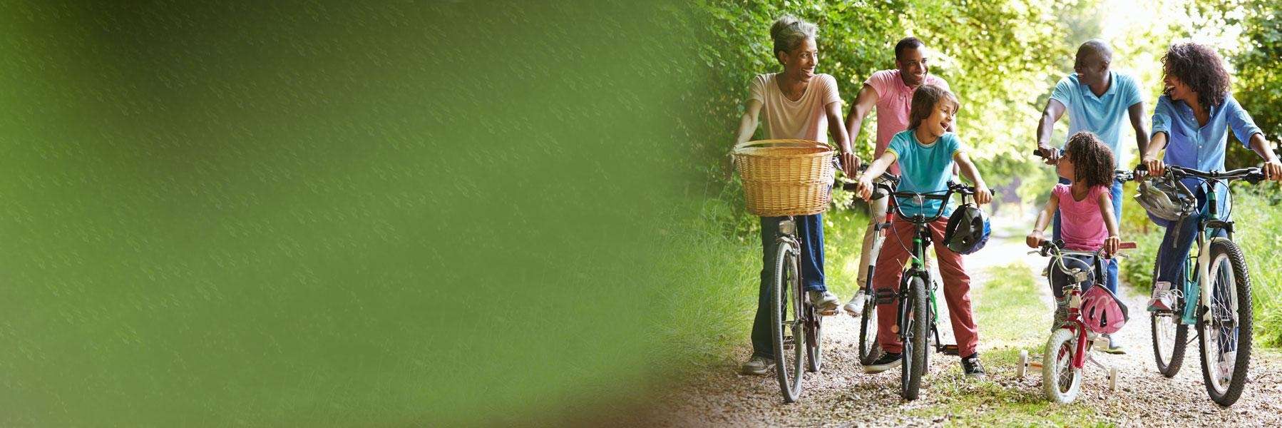 A family riding their bikes on a path