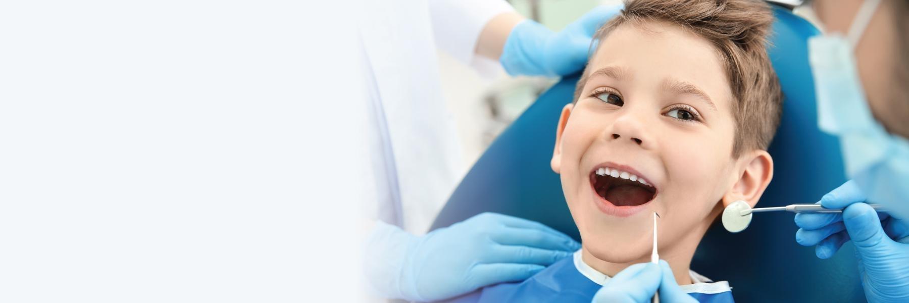 Young boy in patient chair getting dental exam, Corona CA